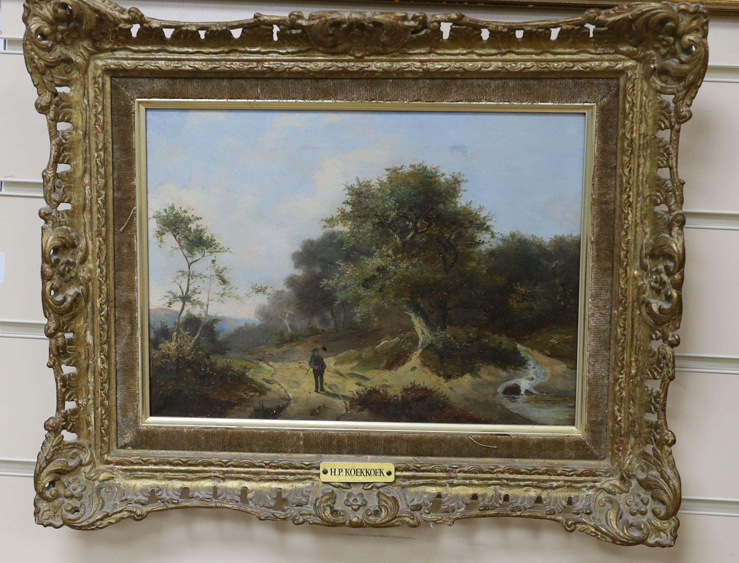 Hendrik Pieter Koekkoek (Dutch, 1843-1927), oil on canvas, Figure on a country lane, initialled, Eastbourne Fine Art label verso, 21 x 29cm